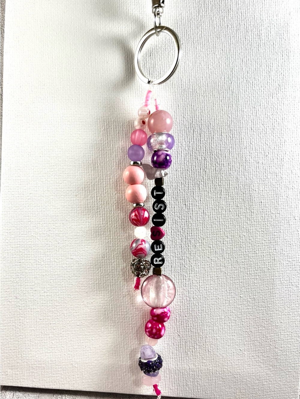 Pink and purple “resist” keychain or bag charm
